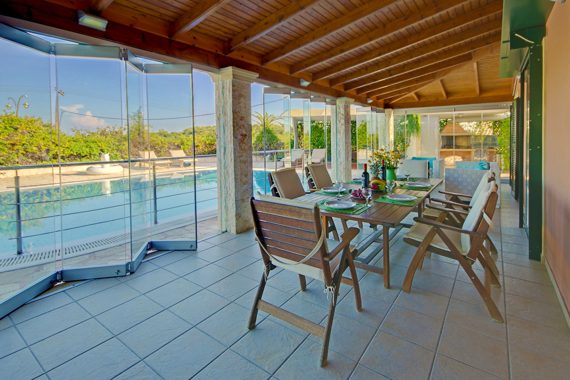  villa  dassia corfu airbnb  emily pool family dining 